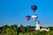 Hot air balloons float over the iconic train depot in Boise Idaho