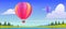 Hot air balloons flying above pond, field, rocks