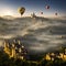 Hot air balloons flying colorful background castles and fog