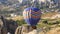 Hot Air Balloons Flying Over Hoodoos and Fairy Chimneys in Goreme Valley Cappadocia, Urgup Turkey