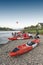 Hot air balloons flying over Nam Song River and tourist kayaks in Vang Vieng, popular resort town in Lao PDR