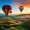 Hot air balloons flying over rolling hills