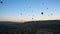 Hot air balloons flying over valley at sunrise. Cappadocia. Turkey