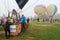 Hot air balloons on the ground on a misty day