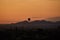 Hot air balloons hovering over pagoda