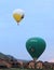 Hot air balloons landing on courtyards
