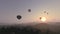 Hot air balloons in the misty sunset