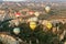 Hot air balloons over mountain landscape in Cappadocia