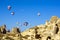 Hot air balloons overhanging the ancient dwellings of Cappadocia, Turkey