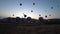Hot air balloons rising in the air in Cappadocia, Turkey