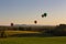 Hot air balloons rising in the sky in early morning over Knoxford, New Brunswick, Canada