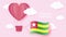 Hot air balloons in shape of heart flying in clouds with national flag of Togo. Paper art and cut, origami style with love to Togo