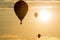 Hot air balloons soaring at sunset