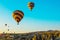 Hot air balloons take off at sunrise over Cappadocia, Goreme, Turkey