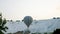 Hot air colorful balloon fly over the white limestone mountains