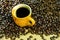 Hot americano, Black coffee in yellow cup with coffee beans on sack backgrond
