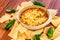 Hot bean dip with jalapenos, sour cream and melted cheddar chees