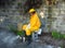 A hot beekeeper sitting in the shade with his smoker after working with his hives in the tropics