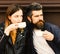 Hot beverage and dating. Girl and bearded guy have coffee