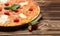 Hot big margarita pizza with mozzarella melting cheese bacon tomatoes