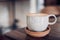 Hot cappuccino coffee cup on wooden tray with latte art on wood table at cafe.food and drink concept