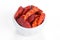Hot chili peppers in a bowl on white background
