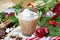 Hot chocolate Christmas and New Year celebration cocoa drink in a glass cup with fir tree branches, holiday decorations and sweet