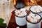 Hot chocolate with marshmallow candies on wooden background