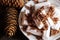 Hot chocolate with marshmallow in a cup, pine cones