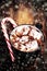 Hot Chocolate with marshmallows and candy stick, traditional beverage for winter time, vintage toning. Christmas