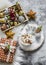 Hot chocolate with marshmallows, christmas decorations, fluffy carpet on a gray background, top view. Christmas background