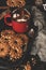 Hot chocolate with marshmallows and cookies with nuts, rustic scene. Dark food photo