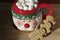 hot chocolate Santa Clause cute mug with marshmallows, and gingerbread cookies on wooden table