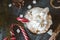 hot chocolate with whipped cream, marshmallows and red Lollipop on a black background, hot winter drink