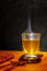 Hot clear Japanese tea in a glass elegant with chopsticks