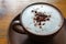 Hot cocoa with frothed milk in ceramic cup