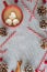 Hot cocoa with marshmallows, candy canes, and pinecones Christmas flat lay