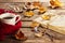 Hot coffee, book, glasses and autumn leaves on wood background