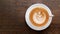 Hot coffee cappuccino latte art top view on wood background