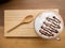 Hot coffee or chocolate served with milk foam and wooden saucer