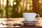 Hot coffee in the cup on blurred dark green nature background