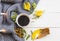 Hot coffee ,knitting wool scarf ,ylang ylang flowers and yellow leaves of lifestyle woman relax in autumn