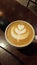 Hot coffee latte with leaf foam pattern
