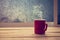 Hot coffee red cup on wood table