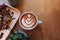 Hot Coffee on wooden table with chocolat on bread