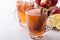 Hot cozy autumn and winter mulled cider drinks with apple slices