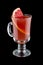 Hot cranberry drink with grapefruit. Sbiten. Russian traditional cuisine. On dark background.Warming drink