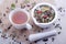 Hot cup of herbal and blackberry tea with white mortar with pestle