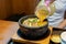 Hot curry ramen in bowl with noodles, meat, and vegetables on food table, popular foods