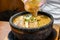Hot curry ramen in bowl with noodles, meat, and vegetables on food table, popular foods